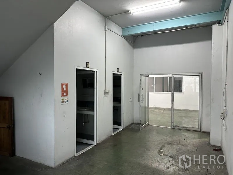 Warehouse for rent in Mueang Samut Prakan, Samut Prakan - Industrial electrical control cabinet and breaker panel mounted on an interior wall.