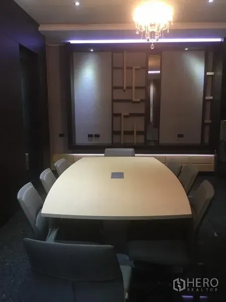 Home Office for rent in Suan Luang, Bangkok - Conference room with rectangular meeting table, eight chairs and chandelier.