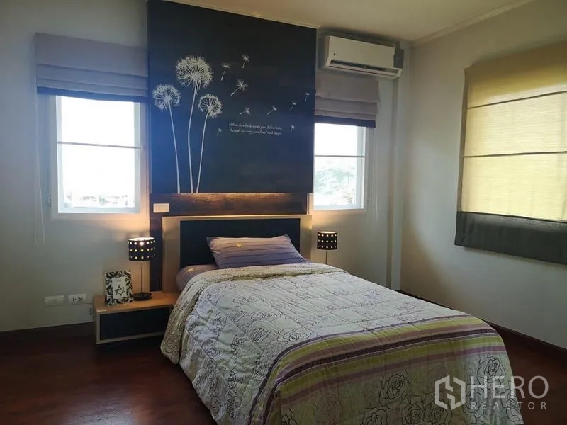 Detached House for rent - Corner bedroom with dandelion mural, bedside lamps, air-conditioner and twin windows.