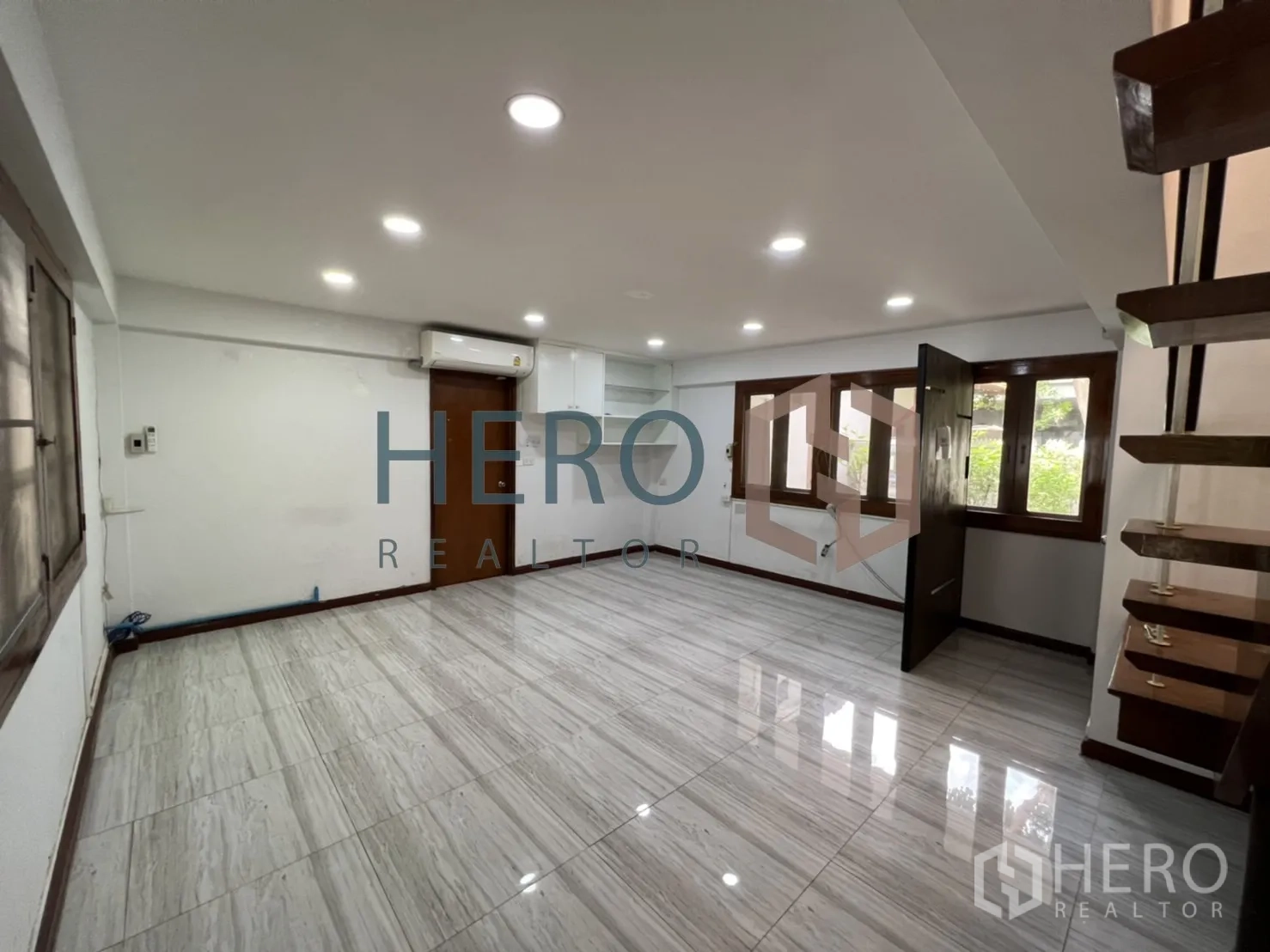 Detached House for rent in Watthana, Bangkok - Secondary living space with staircase, windows and polished tile flooring.