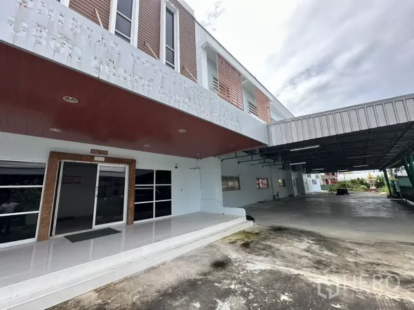 Factory for rent - Covered driveway beside the lobby and access to loading area at ground level.