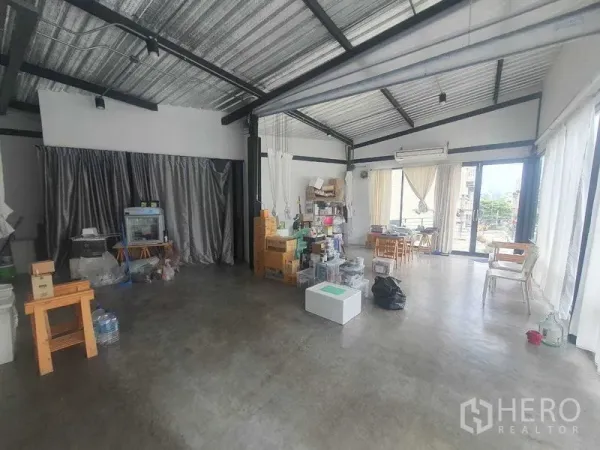 Retail Space for rent in Sathon, Bangkok - Spacious flexible retail floor with industrial ceiling, concrete flooring, and abundant daylight from multiple glass walls.
