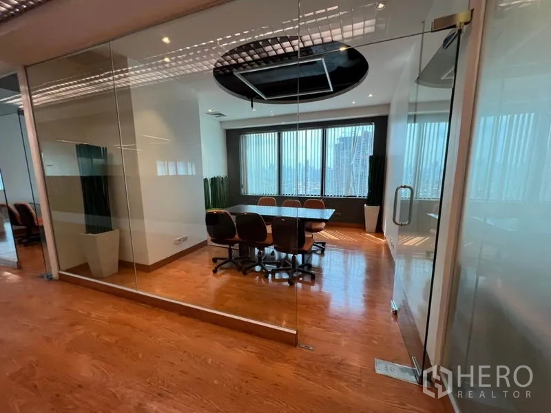Office Space for rent in Khlong Toei, Bangkok - Glass-walled meeting room with city views, long table and executive chairs.
