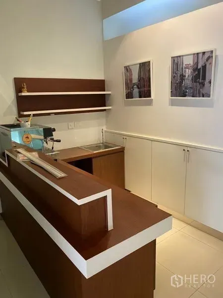 Home Office for rent in Wang Thonglang, Bangkok - Pantry area with wooden counter, sink and floating wall shelves.