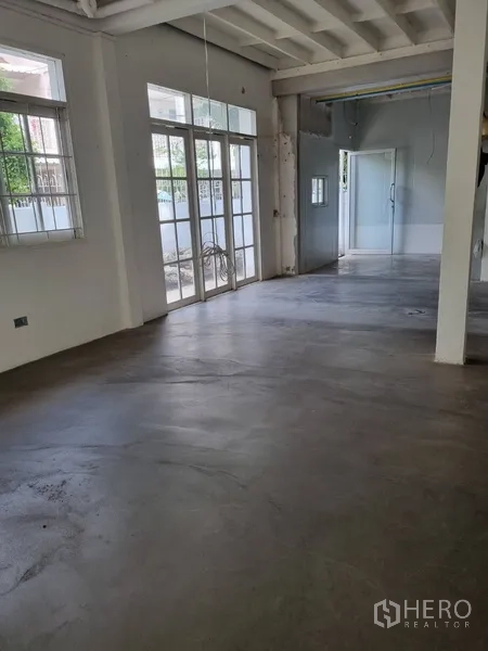 Detached House for rent or sale in Sathon, Bangkok - Hallway view to living area with French doors and sliding glass partitions.
