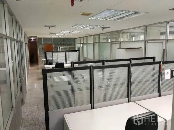 Office Space for rent in Bang Na, Bangkok - Open-plan workspace with cubicles, glass partitions, and recessed ceiling lighting.