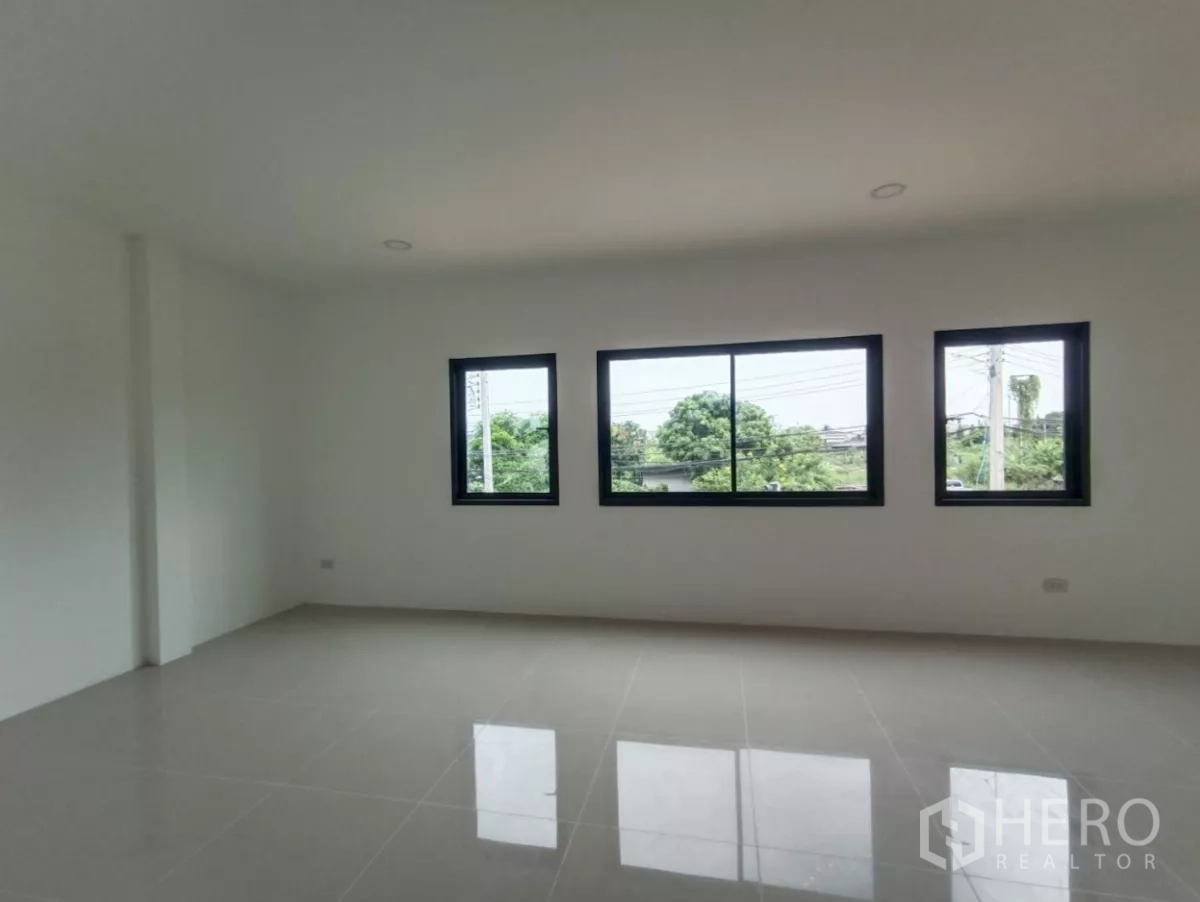 Factory for rent or sale in Bang Yai, Nonthaburi - Upper-level multipurpose room with wide windows overlooking greenery.