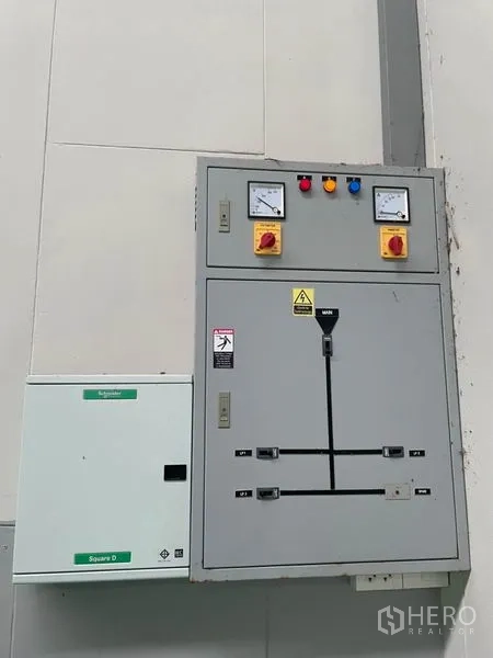 Factory for rent in Lam Luk Ka, Pathum Thani - Industrial electrical control panel mounted on interior wall.