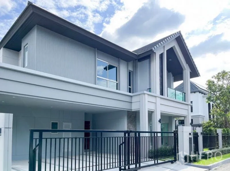 独立式住宅 出租 - 现代两层独立屋外观，带大门车道与阳台。