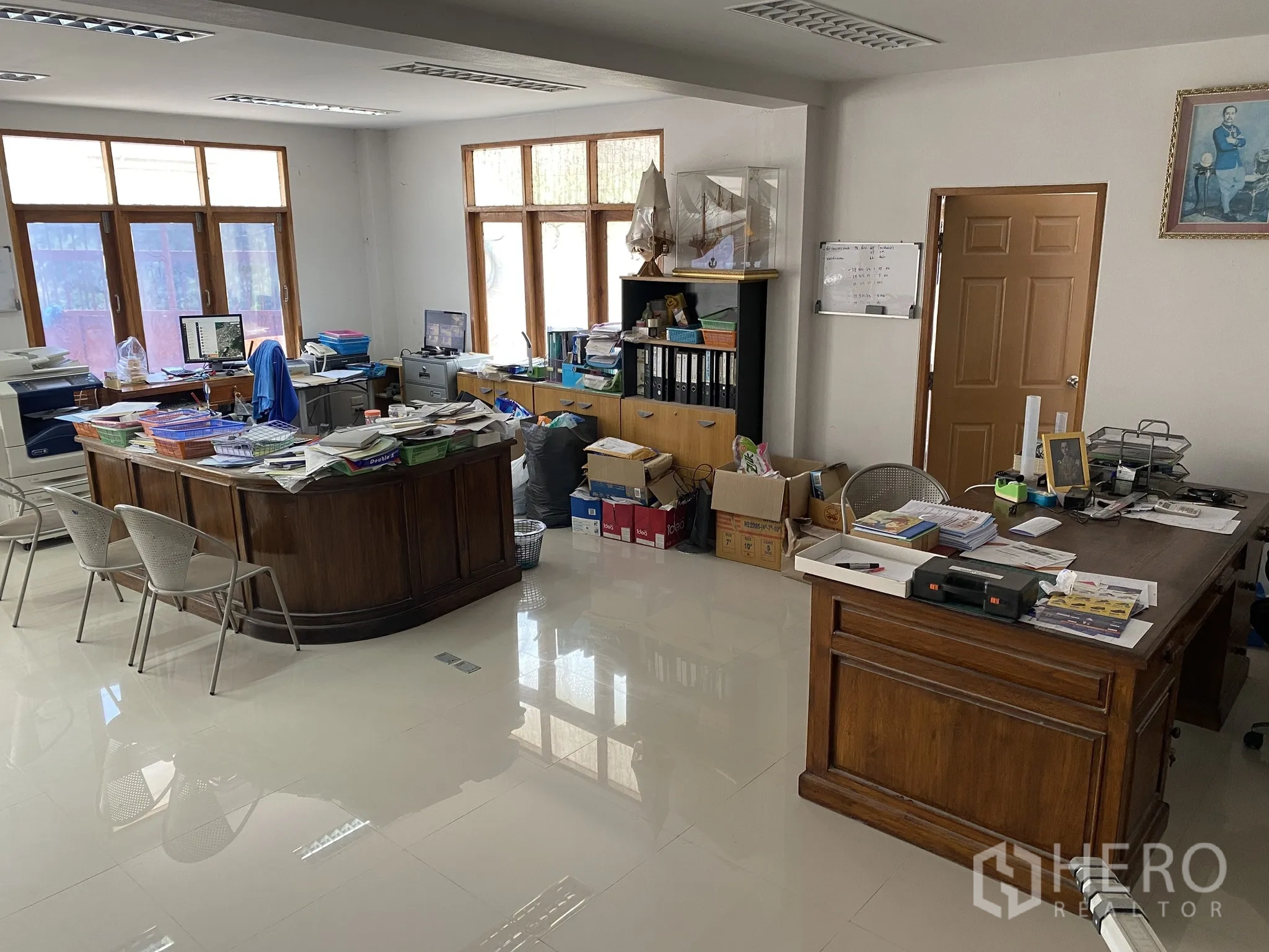 Factory for sale in Mueang Chon Buri, Chon Buri - Main office workspace with desks, computers, files and windows.