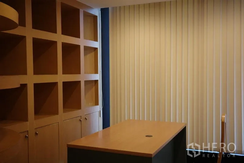 Office Space for rent in Bang Na, Bangkok - Private office with extensive built-in shelves, base cabinets and vertical window blinds.