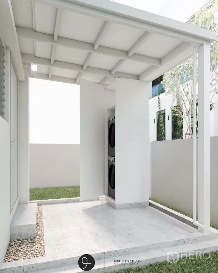 Detached House for rent in Bang Phli, Samut Prakan - Covered outdoor utility area with stacked washer and dryer next to the lawn