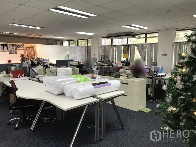 Office Space for rent in Khlong Toei, Bangkok - Furnished open workspace with modular desks, office equipment and carpet tiles under grid ceiling lights.