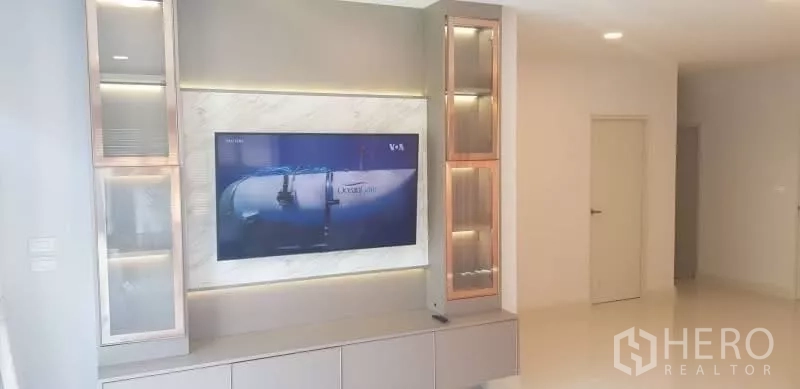 Detached House for rent in Bang Phli, Samut Prakan - Built-in TV wall unit with display cabinets and mounted television.