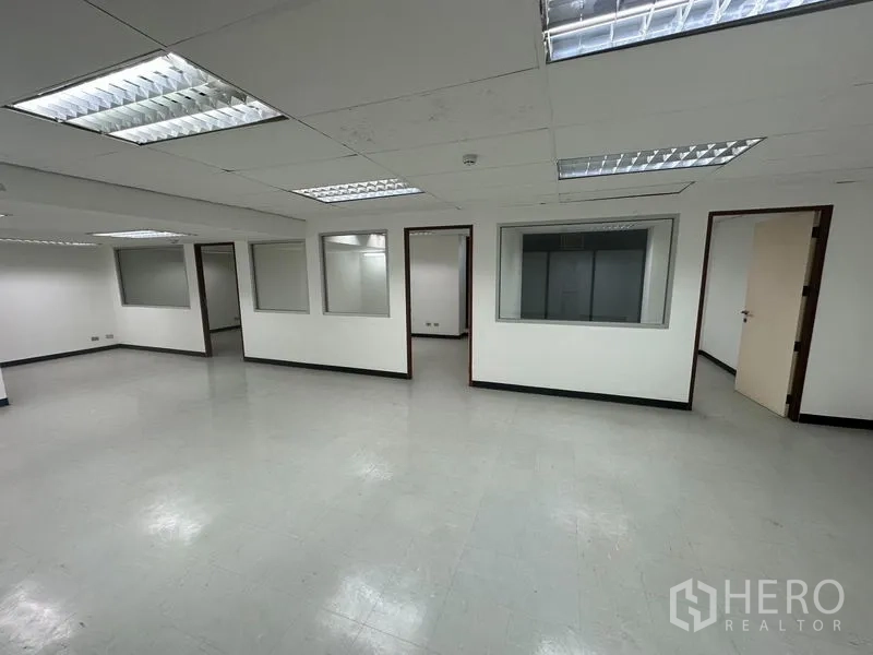 Office Space for rent in Khlong Toei, Bangkok - Central workspace facing internal windows and doors to meeting rooms.