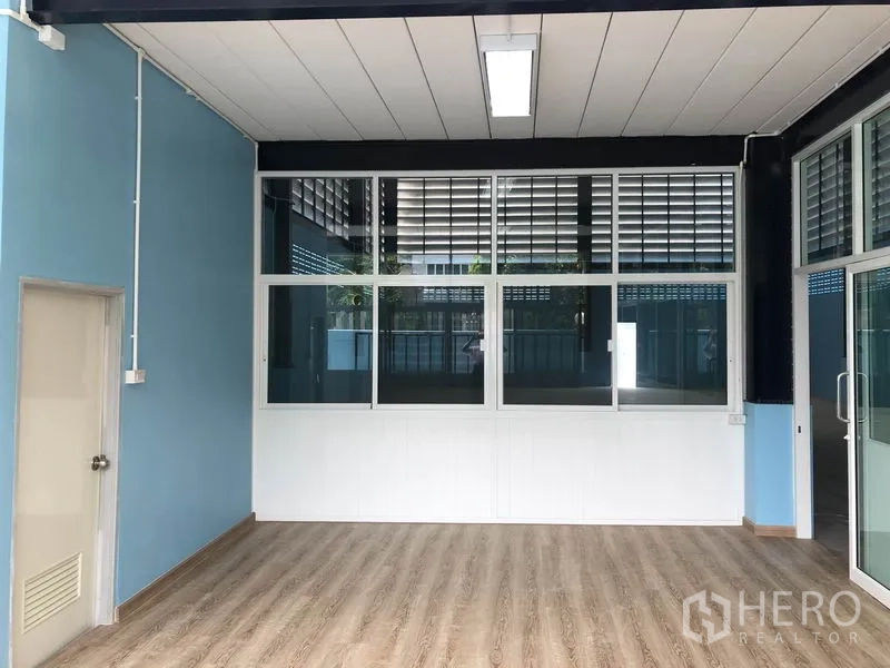 Factory for rent or sale in Bang Bua Thong, Nonthaburi - Glazed office section with suspended ceiling opening to the workshop.