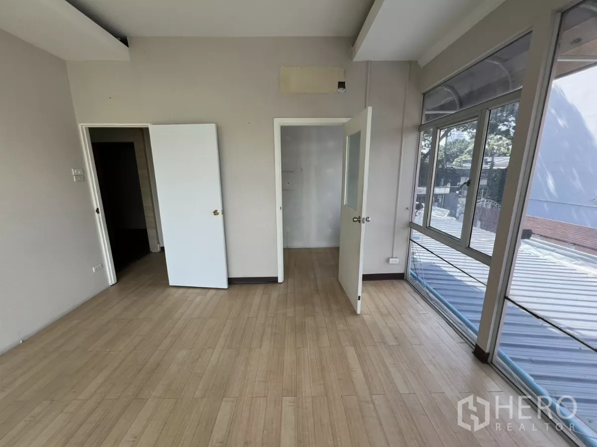 Retail Space for rent - Corner office with two doors and wraparound windows above the street.