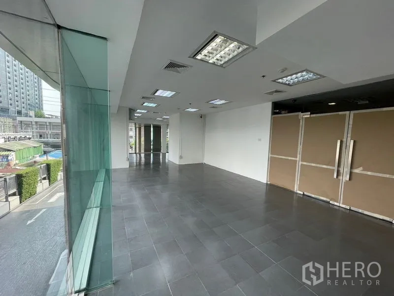 Office Space for rent - Street-side office zone with panoramic glazing and double entry doors.
