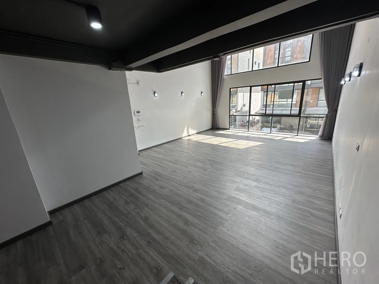 Home Office for rent or sale in Suan Luang, Bangkok - Double-height workspace with full-height windows bringing abundant natural light.