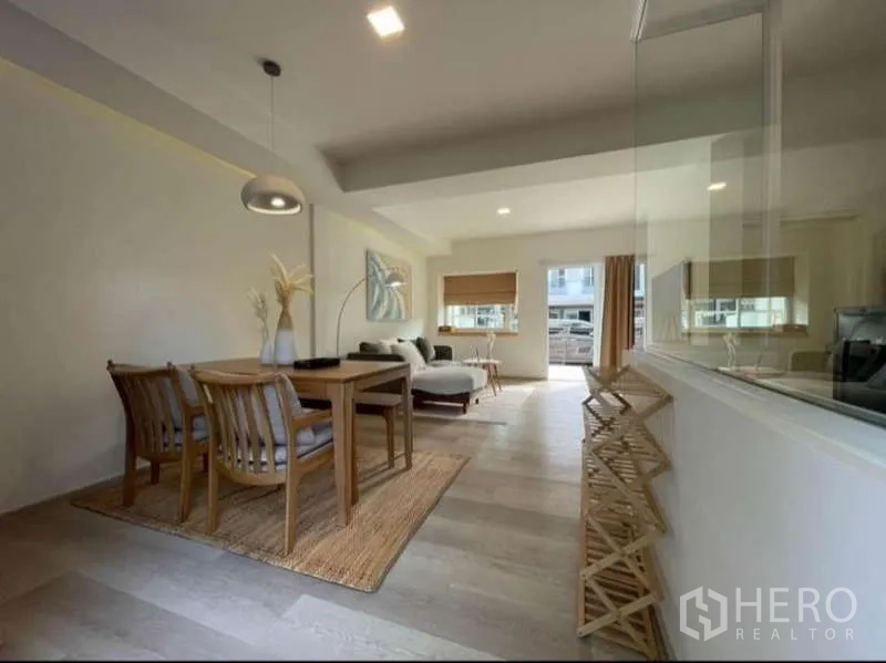 Townhouse for rent in Prawet, Bangkok - View from kitchen to dining and living areas with abundant daylight