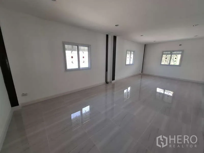 Warehouse for rent or sale in Bang Phli, Samut Prakan - Corner office space with three windows and bright tiled floor.