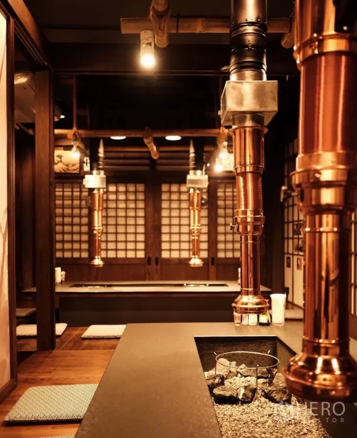 Shophouse for rent in Bang Rak, Bangkok - Private dining room with grill tables and copper exhaust hoods in Bang Rak shophouse.