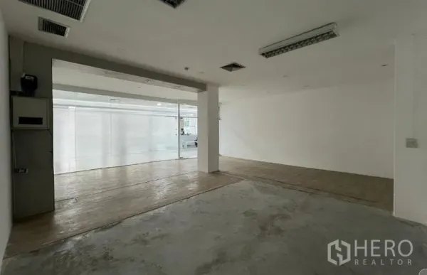 Retail Space for rent - Open-plan shop interior showing white walls, ceiling vents and a clear glass front ready for fit-out.