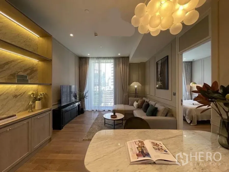 Condominium for rent in Pathum Wan, Bangkok - Marble countertop looking toward balcony living room and separate bedroom.