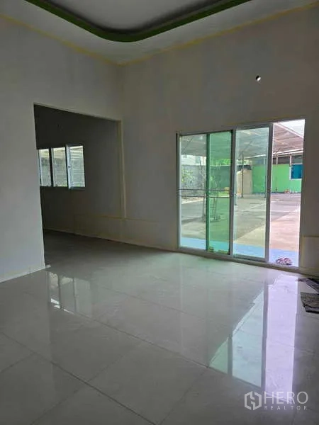 Warehouse for rent in Khlong Sam Wa, Bangkok - Bright office area with sliding doors opening to the yard.