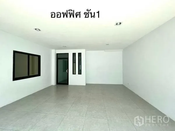 Factory for rent or sale in Mueang Samut Sakhon, Samut Sakhon - First-floor office room with tiled floor, window and glass door.