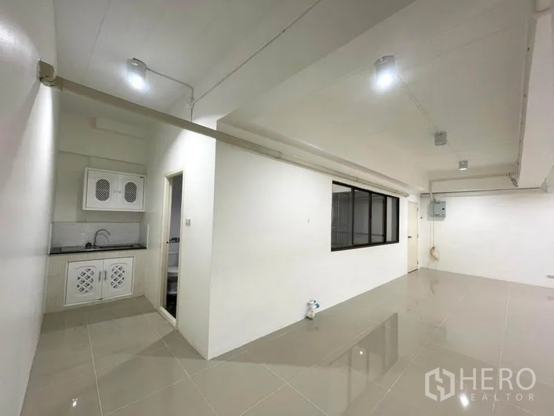 Office Space for rent in Khlong Toei, Bangkok - Office area featuring a pantry section, interior window and wall-mounted electrical panel.