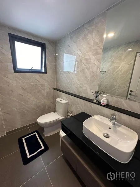 Detached House for rent in Bang Phli, Samut Prakan - Guest bathroom with tiled walls, vessel sink vanity and exterior window.