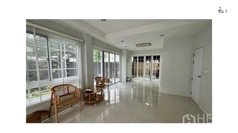 Home Office for rent - Ground-floor lobby with glossy tiles and full-height windows facing a small garden.