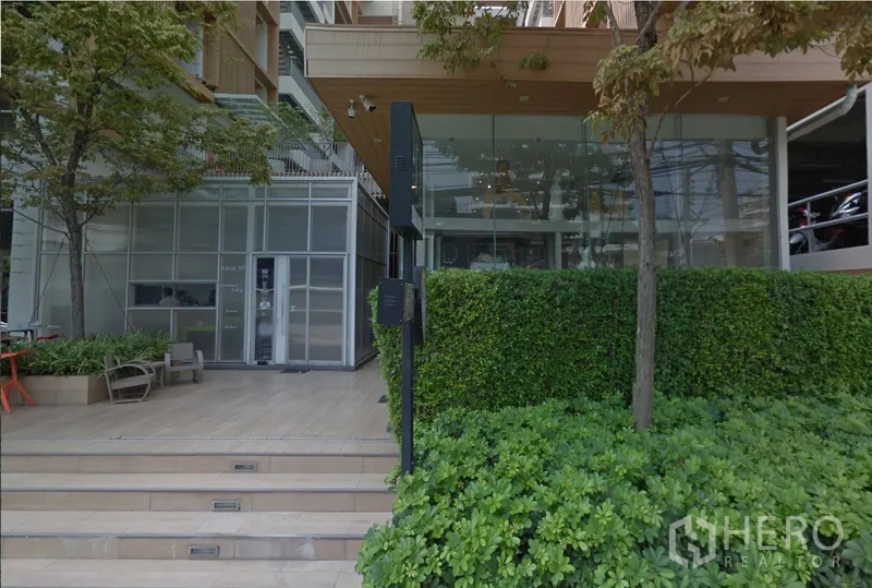 Retail Space for rent in Watthana, Bangkok - Entrance steps leading to landscaped plaza and glass retail unit under a canopy.