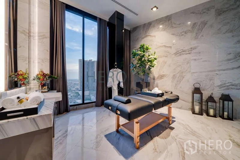 Condominium for rent - On-site spa room with massage bed, marble walls and skyline views in the condominium.