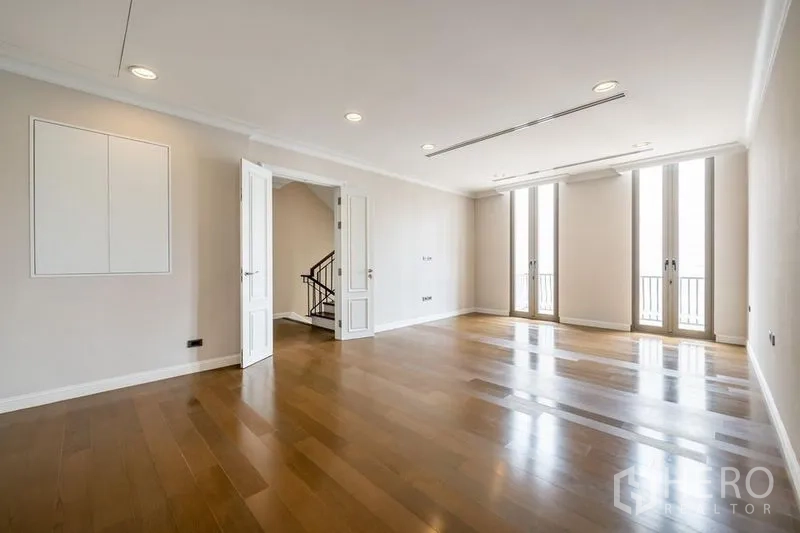 Townhouse for rent in Khlong Toei, Bangkok - Second living or family room with double doors and abundant natural light.