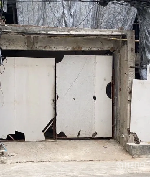 Retail Space for rent in Watthana, Bangkok - Street-level retail frontage in central Sukhumvit with a concrete frame and white temporary hoarding, showing a unit under renovation.