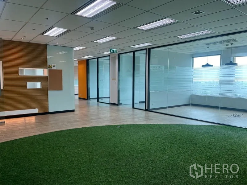 Office Space for rent in Chatuchak, Bangkok - Bright open office with curved turf zone, glass meeting rooms and distant skyline views.