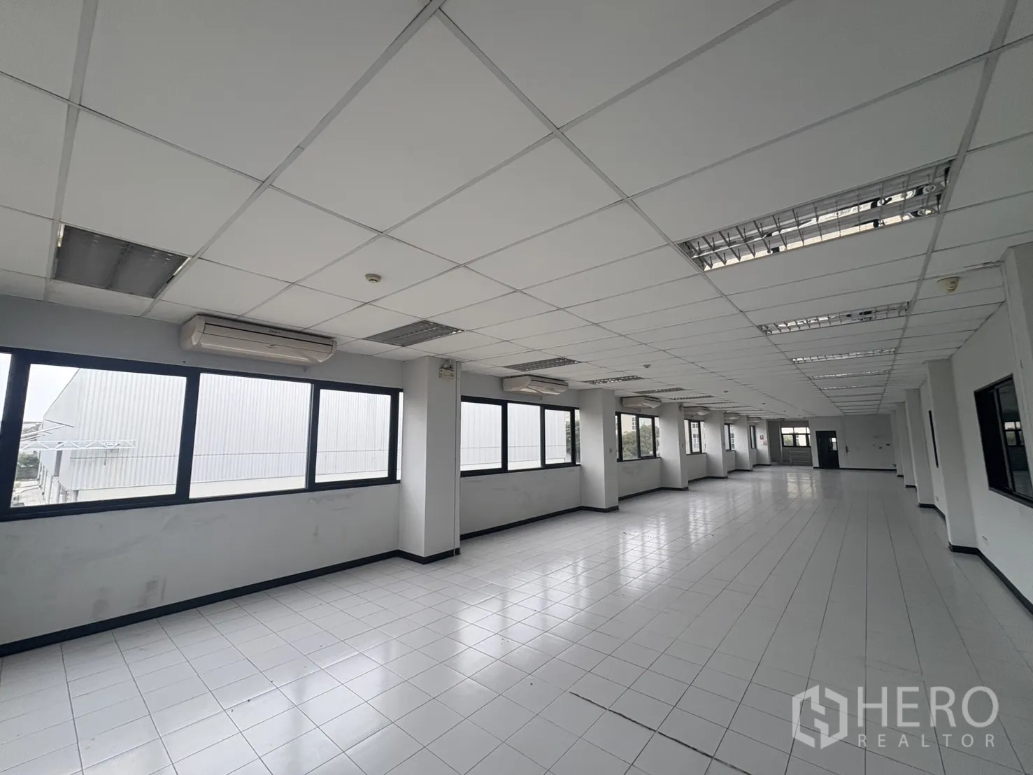 Factory for rent or sale in Samut Prakan - Office bathroom with sink, mirror and shower cubicle.