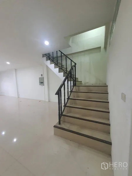 Home Office for rent or sale in Yan Nawa, Bangkok - Staircase with black metal railing connecting upper office floors.