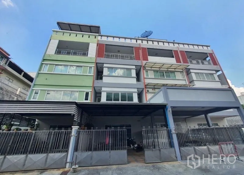 Home Office for rent or sale in Yan Nawa, Bangkok - Street-level view of a modern townhouse-style home office with gates.