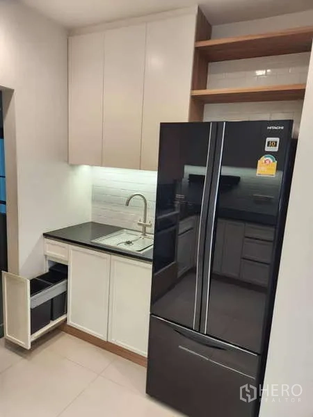 Detached House for rent in Sathon, Bangkok - Pantry zone with sink, cabinetry, and a black French-door refrigerator.