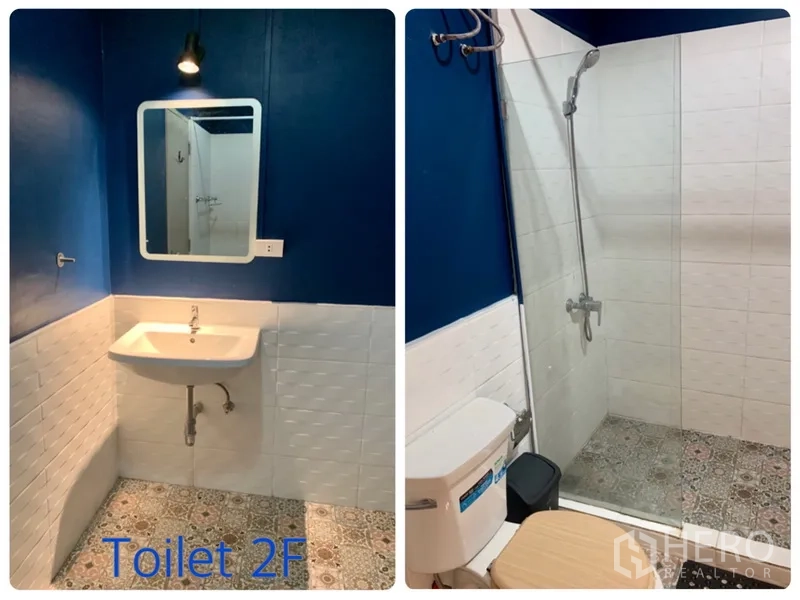 Townhouse for rent in Watthana, Bangkok - Blue and white bathroom with walk-in shower, patterned floor tiles and vanity.