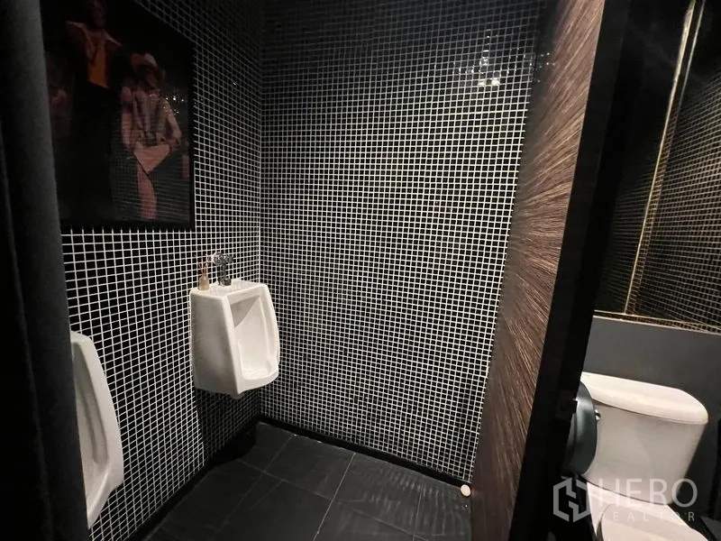Retail Space for rent in Watthana, Bangkok - Restroom finished with black-and-white mosaic tiles, urinal and toilet.
