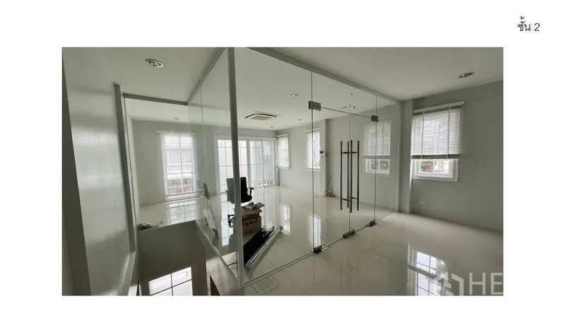 Home Office for rent - Second-floor glass-walled meeting room with sliding doors and daylight from two sides.
