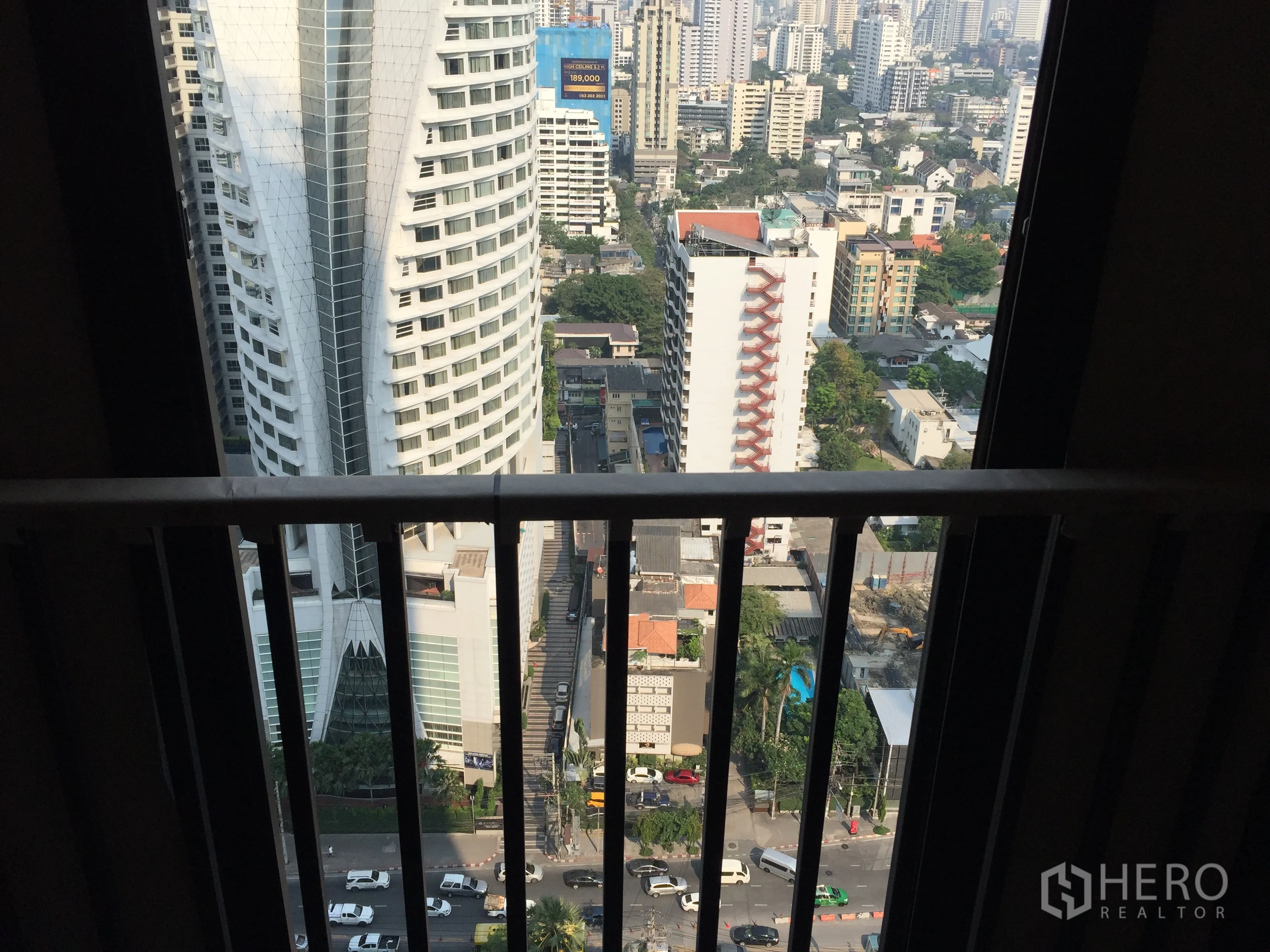 Condominium for sale in Watthana, Bangkok - High-floor balcony view over the Asok–Sukhumvit cityscape.