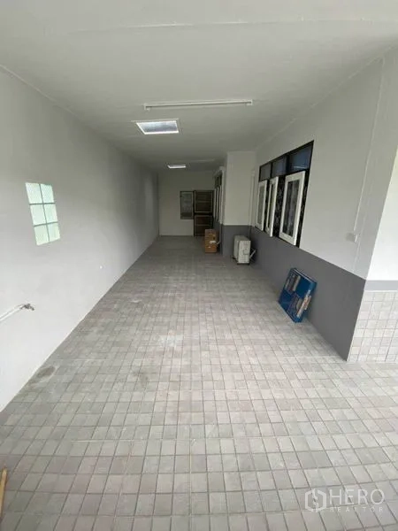 Detached House for rent in Huai Khwang, Bangkok - Long covered side terrace or utility area with tiled flooring.