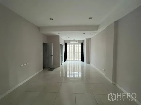 Home Office for rent or sale - Open-plan ground floor with glossy white tiles, recessed lights and glass doors.