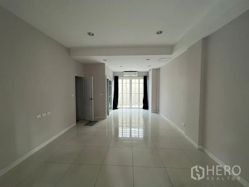 Home Office for rent or sale - Open-plan ground floor with glossy white tiles, recessed lights and glass doors.