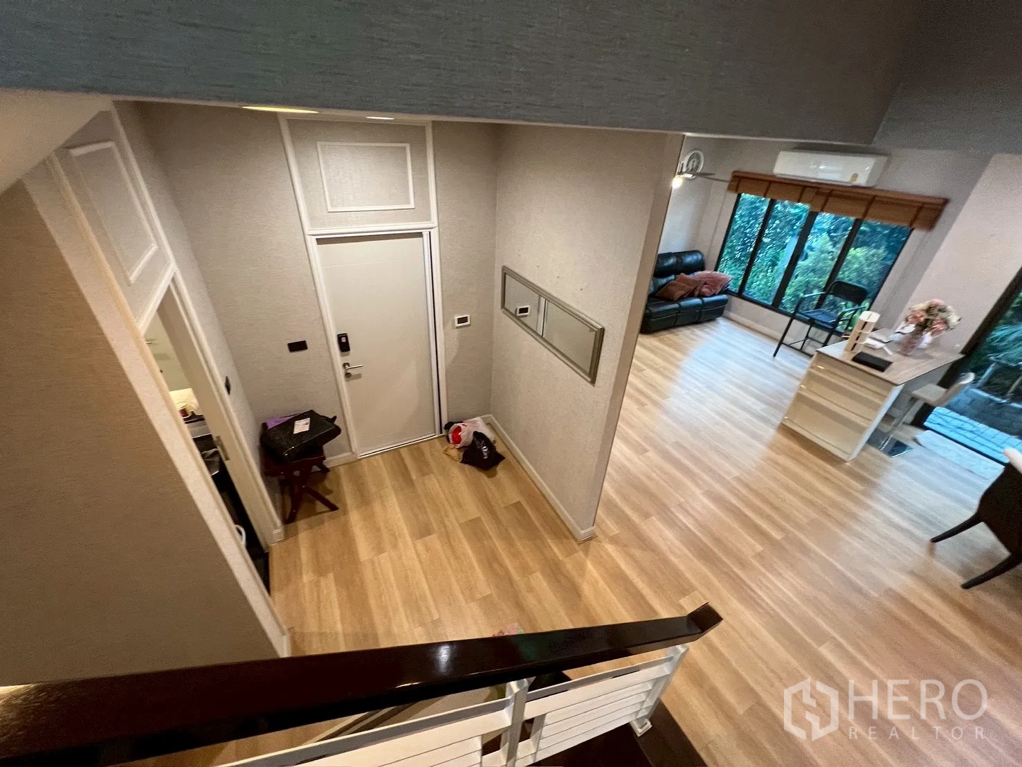 Detached House for rent in Bang Kapi, Bangkok - View from staircase to entry hall and living area with garden outlook.
